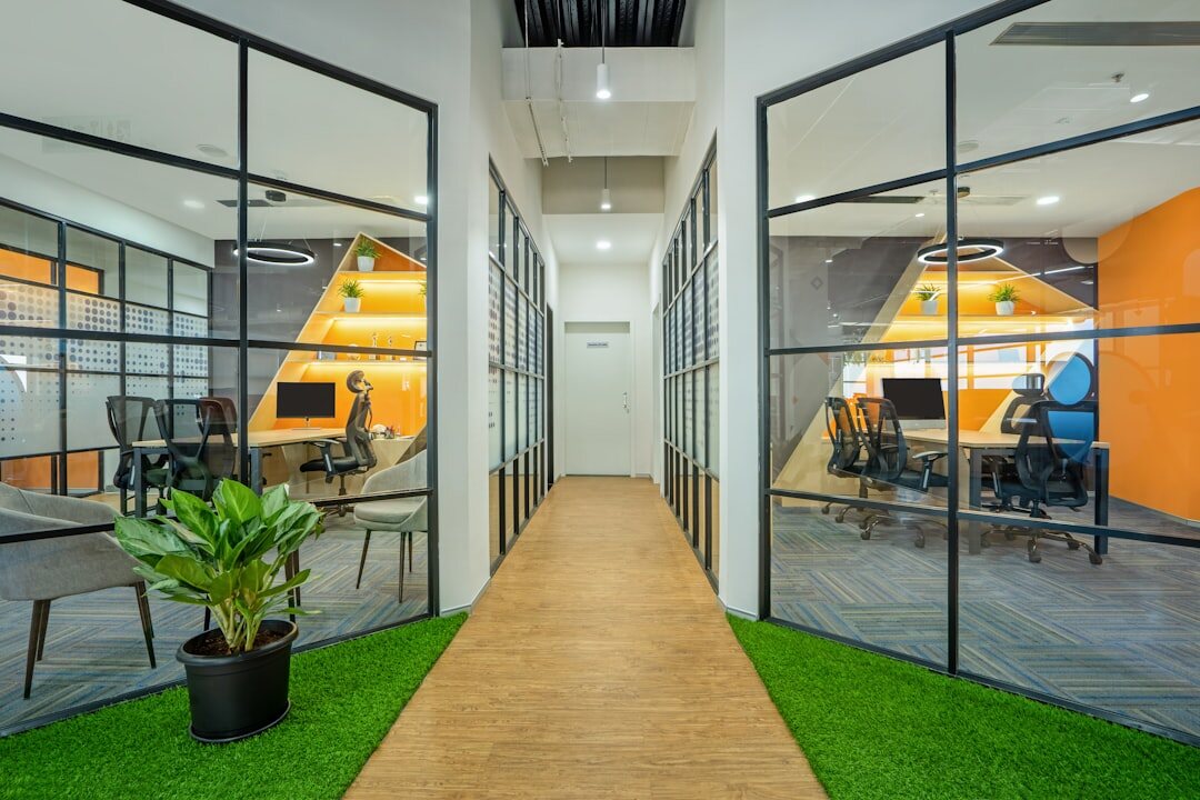 Modern newsroom office with desks and large windows